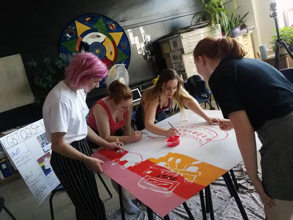 Young people painting murals