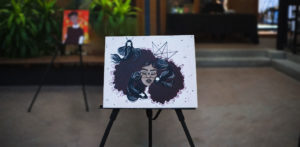 Painting of a girl on an easel